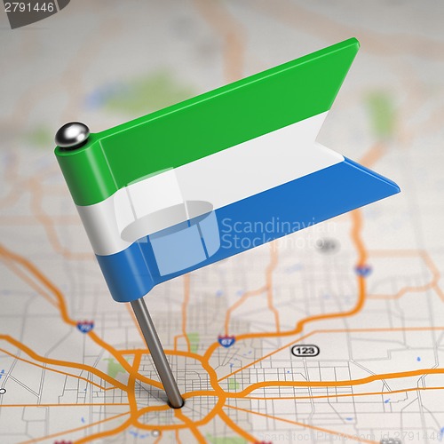 Image of Sierra Leone Small Flag on a Map Background.