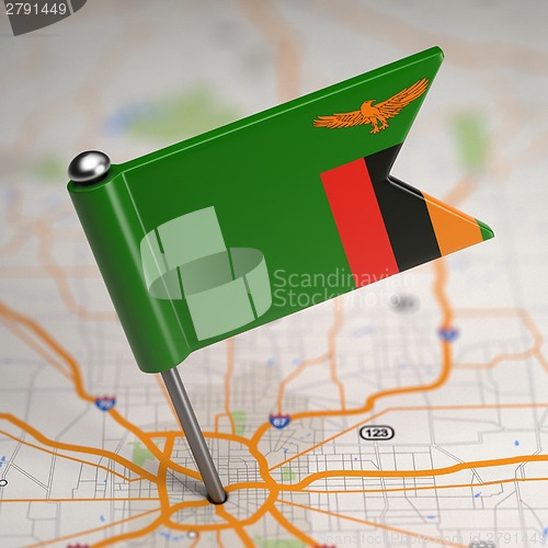 Image of Zambia Small Flag on a Map Background.