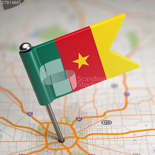 Image of Cameroon Small Flag on a Map Background.