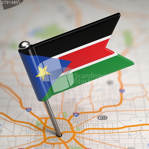 Image of South Sudan Small Flag on a Map Background.