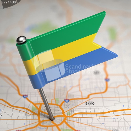 Image of Gabon Small Flag on a Map Background.