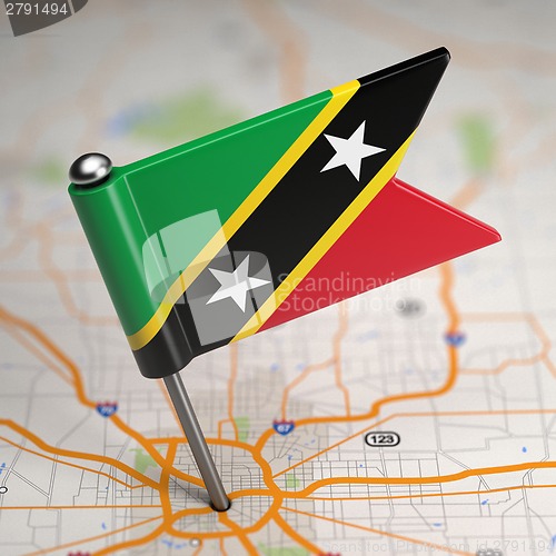 Image of Saint Kitts and Nevis Small Flag on a Map.