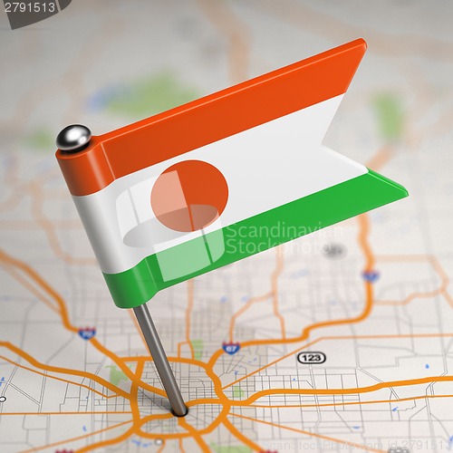 Image of Niger Small Flag on a Map Background.