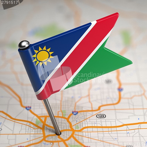 Image of Namibia Small Flag on a Map Background.