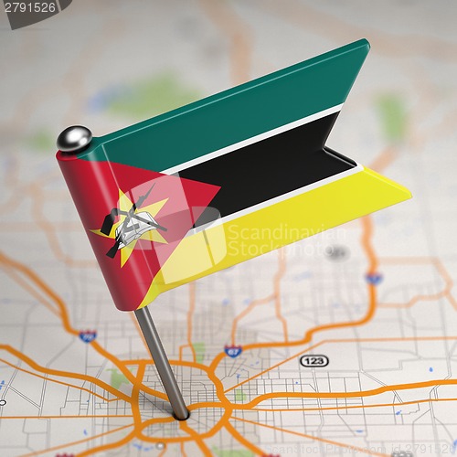 Image of Mozambique Small Flag on a Map Background.