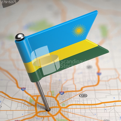 Image of Rwanda Small Flag on a Map Background.