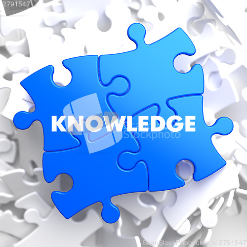 Image of Knowledge Concept on Blue Puzzle.