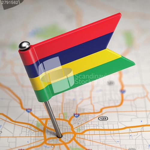 Image of Mauritius Small Flag on a Map Background.