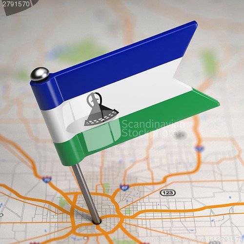 Image of Lesotho Small Flag on a Map Background.