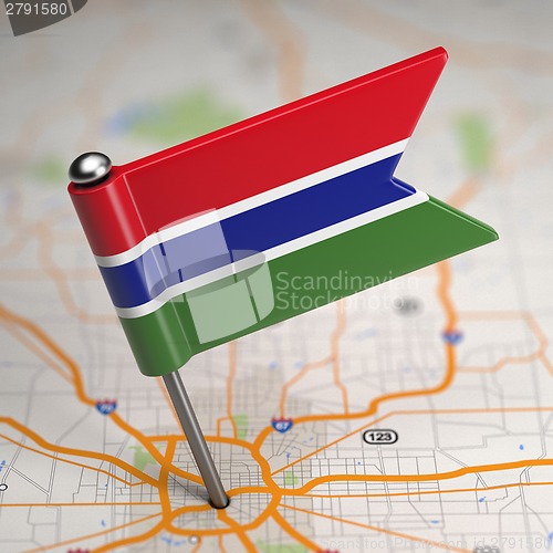 Image of Gambia Small Flag on a Map Background.
