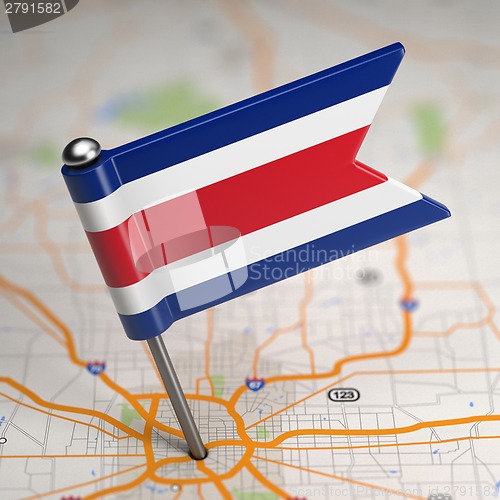 Image of Costa Rica Small Flag on a Map Background.