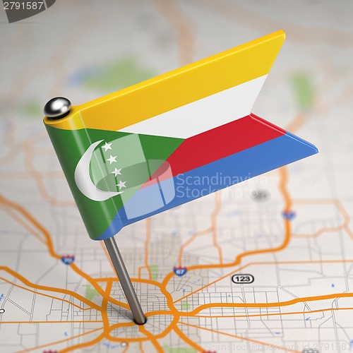 Image of Comoros Small Flag on a Map Background.