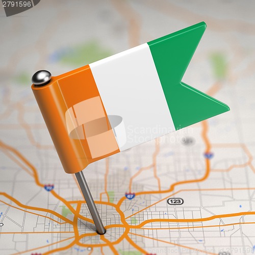 Image of Cote d'Ivoire Small Flag on a Map Background.