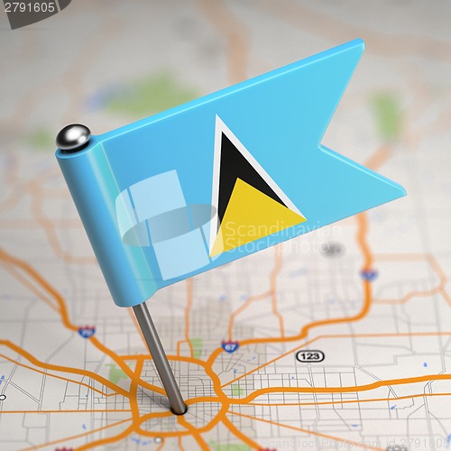Image of Saint Lucia Small Flag on a Map Background.