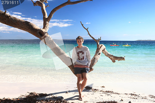 Image of Teen boy enjoying tropical beach  leisure vacation holiday