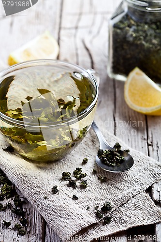 Image of cup of green tea and lemon 