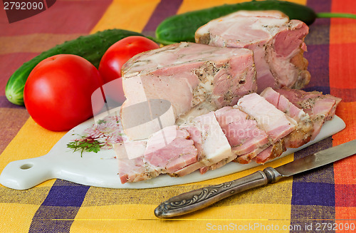 Image of Smoked pork and vegetables on a white plate