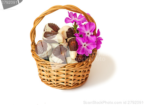 Image of Chocolates in a wattled basket on a white background.