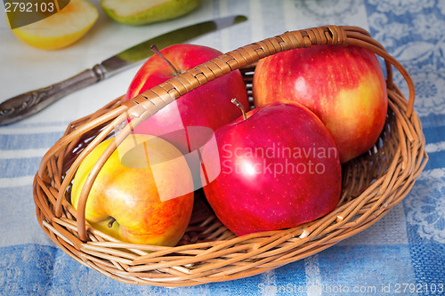 Image of Large apples in a wattled basket.