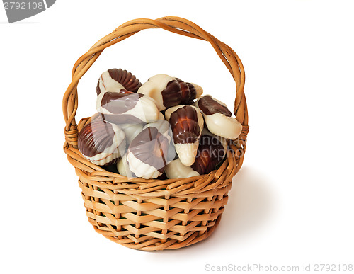 Image of Chocolates in a wattled basket on a white background.