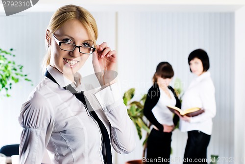 Image of Young business lady at office background