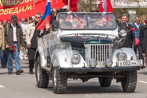 Image of Soldiers in World War 2 uniform on offroad vehicle