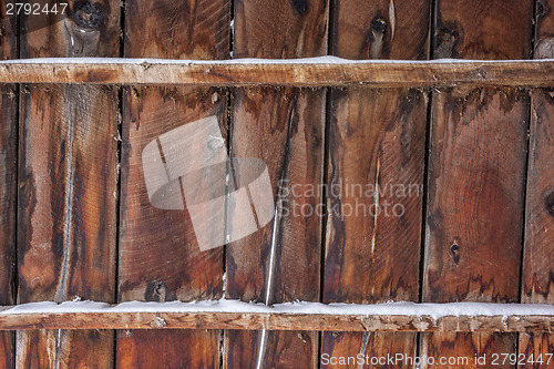 Image of old barn wood with snow