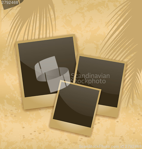 Image of Old style empty photo cards lying on a sea sand