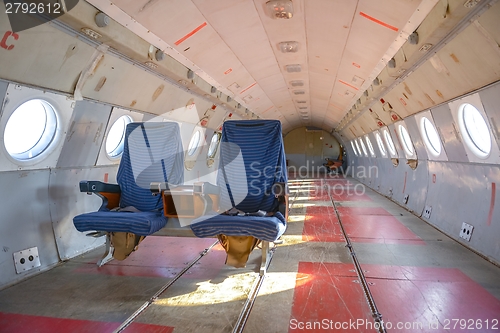 Image of Interior of an airplane with many seats