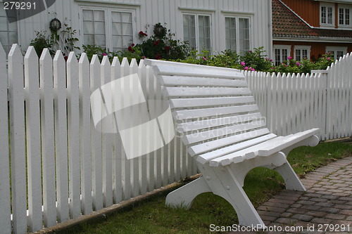 Image of Bench by picket fence