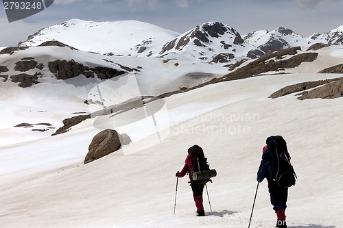 Image of Two hikers on snowy plateau