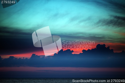 Image of Multicolor sunset sky with clouds on lake