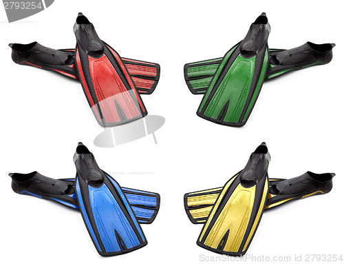 Image of Set of multicolored flippers for diving with water drops