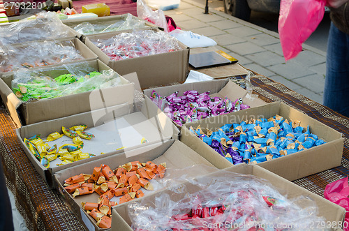 Image of milky caramel candy in cardboard boxes 