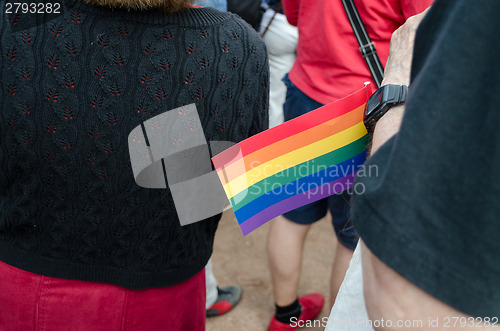 Image of small paper rainbow flag gay parade symbol  