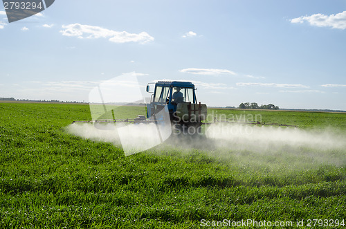 Image of Tractor spray fertilize field pesticide chemical 