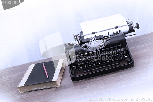 Image of Vintage typewriter and old books