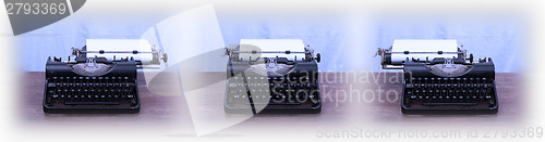 Image of Old typewriter on wooden table