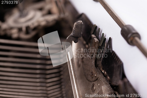 Image of Close-up of an old retro typewriter with paper