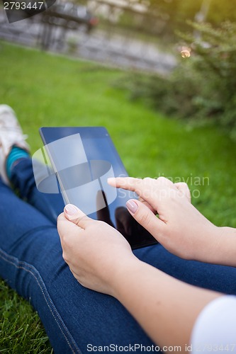 Image of Woman using digital tablet PC