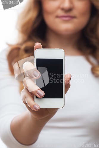 Image of Woman hold cellphone on white