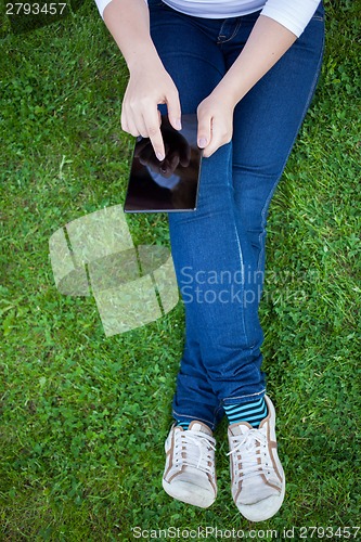 Image of Woman using digital tablet PC