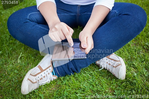 Image of Woman using digital tablet PC