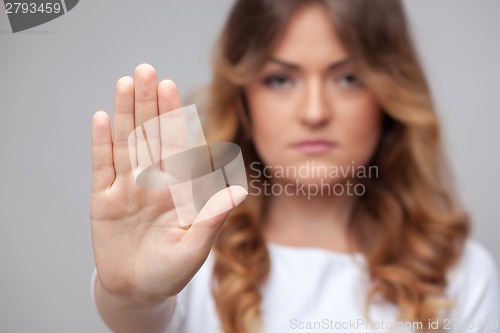 Image of female hand stop sign