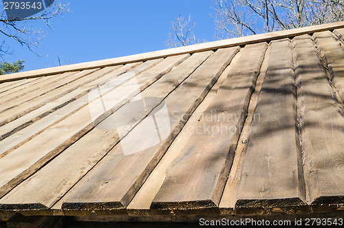 Image of Roof farmhouse dwelling hewn planks close up