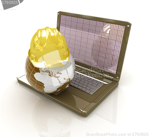 Image of Hard hat and earth on a laptop 