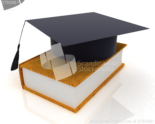 Image of Graduation hat on a leather book