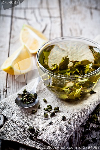 Image of cup of green tea and lemon