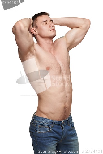 Image of Muscle man posing in studio