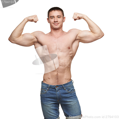 Image of Muscle man posing in studio